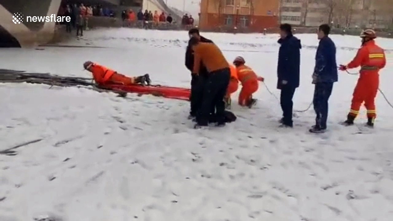 Heroic Chinese firemen rescue mother and son trapped in frozen lake
