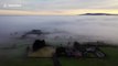 Atmospheric drone footage captures dense fog over Northern Ireland