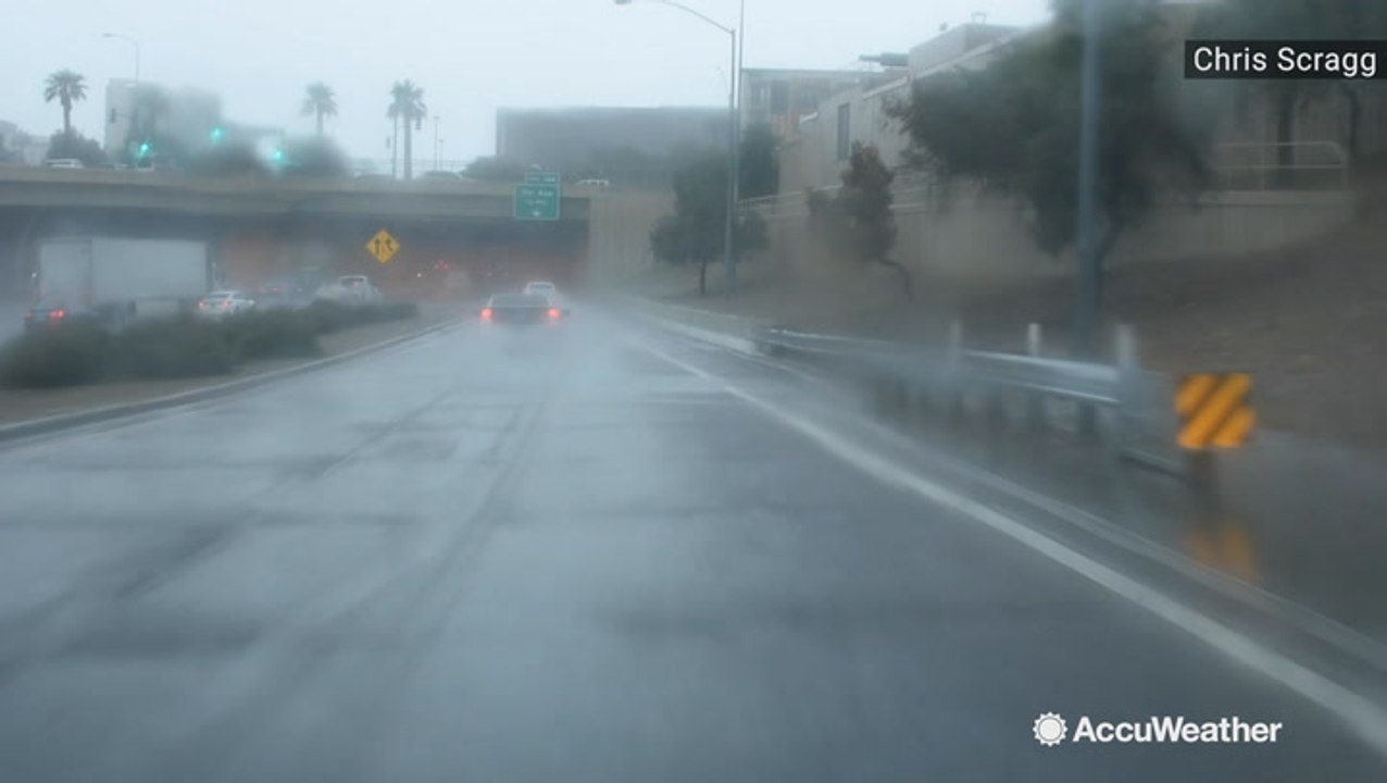Rain pours into city streets