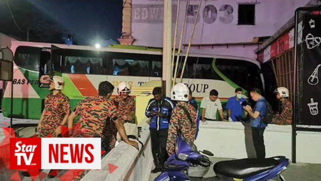 Tour bus driver suffers heart attack and rams bus into shop