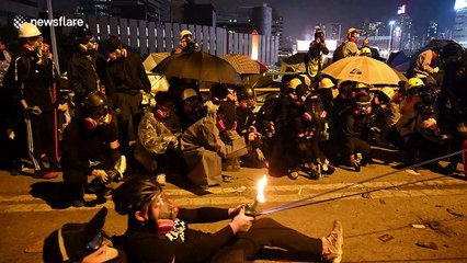 Hong Kong protester misfires flaming petrol bomb from makeshift catapult