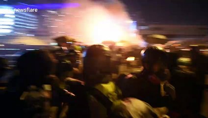 Further footage shows Hong Kong activists unleashing barrage of missiles onto armoured vehicle