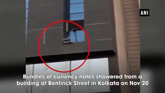 Watch: Bundles of currency notes showered from building in Kolkata during raid