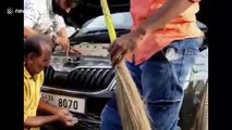 Five-foot-cobra rescued from car bonnet after hours-long struggle in west India