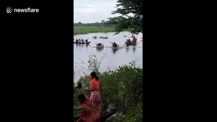 Locals race in giant pots in river in Cambodia