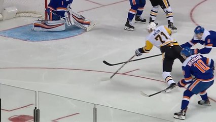 Evgeni Malkin scores a goal while diving