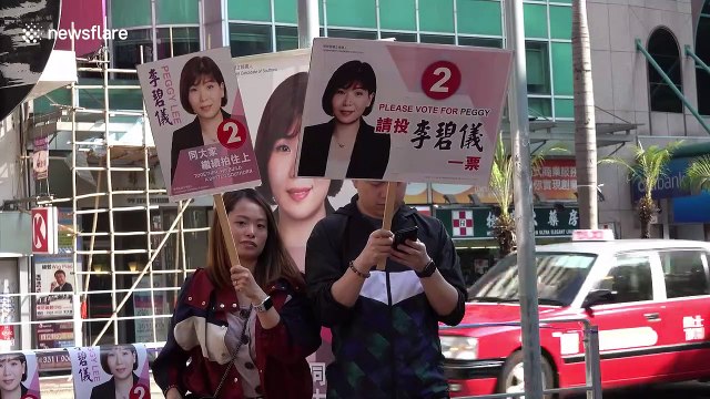 Hong Kong elections: Amid tensions, record numbers vote in district council polls