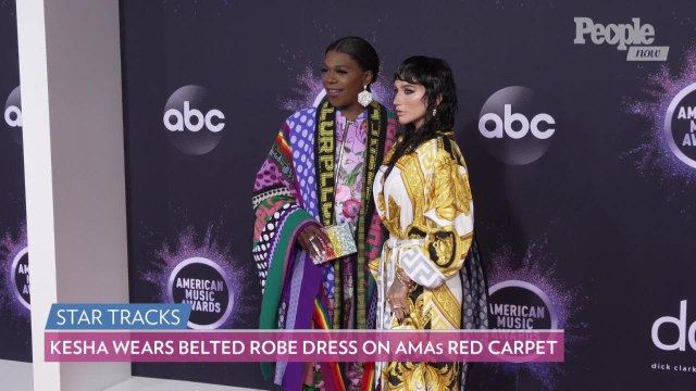 Kesha Wears Belted Robe Dress as She Poses with Big Freedia on AMAs Red Carpet Ahead of Performance