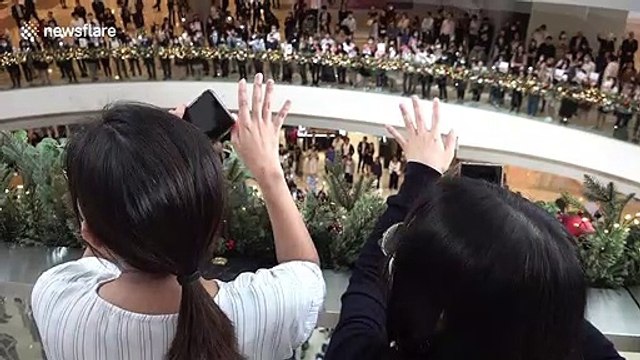 Hong Kong pro-democracy protesters stage peaceful protest inside shopping mall