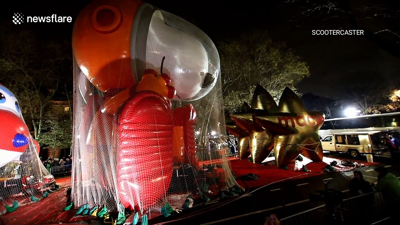Thousands queue to watch the inflation of the balloons for the Macy's Thanksgiving Day Parade