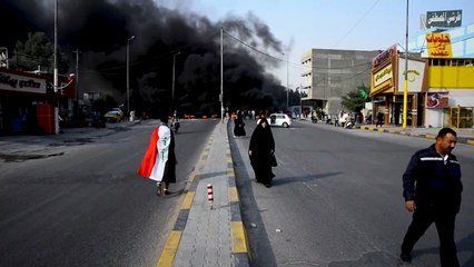 Iraqi protesters block roads with burning tyres in Najaf