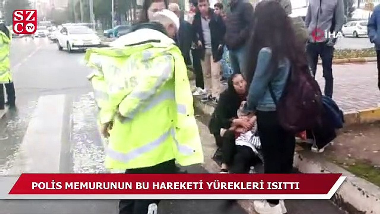 Polis memuru yerde yatan yaralıyı montuyla ısıttı