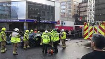 Emergency services cut person out of car after accident outside Tottenham Court Road station