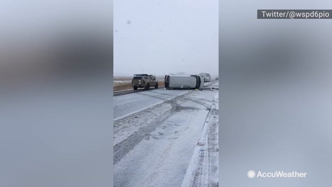Van blocking the highway after rolling over in snow