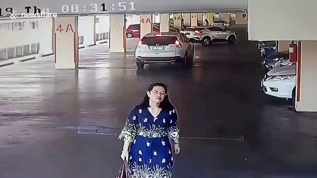 World's worst parking! Driver hits reverse and smashes through 50ft high concrete wall