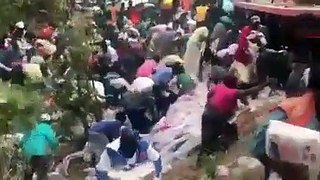 People's hunger settled as a trailer of rice falls.