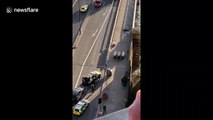 Police remove injured from London Bridge after deadly attack