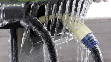 Freezing rainstorm turns charging station into ice sculpture in Ontario