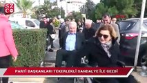 Parti başkanları tekerlekli sandalye ile gezdi