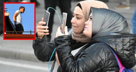 İntihar için çatıya çıktı, meraklılar o anları kameraya kaydetti