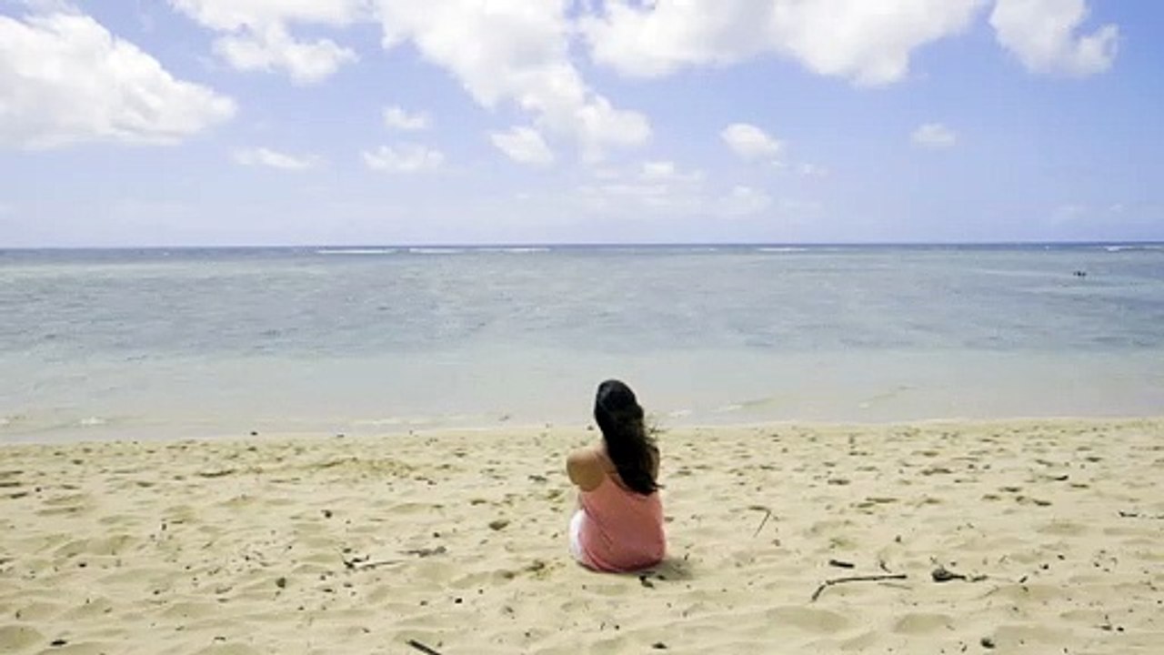 Sitting on the beach Top