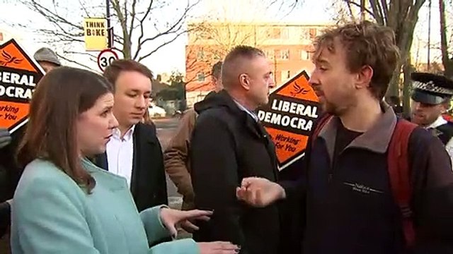 Jo Swinson confronted by protester at youth centre
