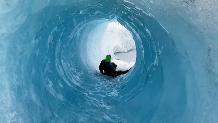 Sliding Through Glacial Ice Cave