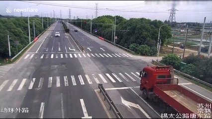 Truck hits two vehicles after crashing through highway's central reservation in China