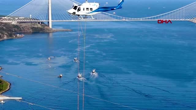İstanbul boğazı'nın üstünde kesintisiz elektrik için ölüme meydan okuyorlar -1