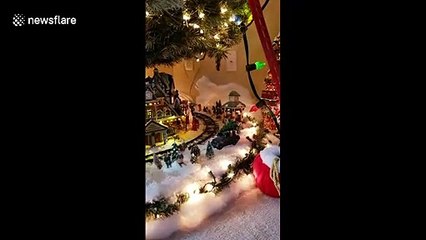 This Christmas tree has an entire miniature village built inside of it