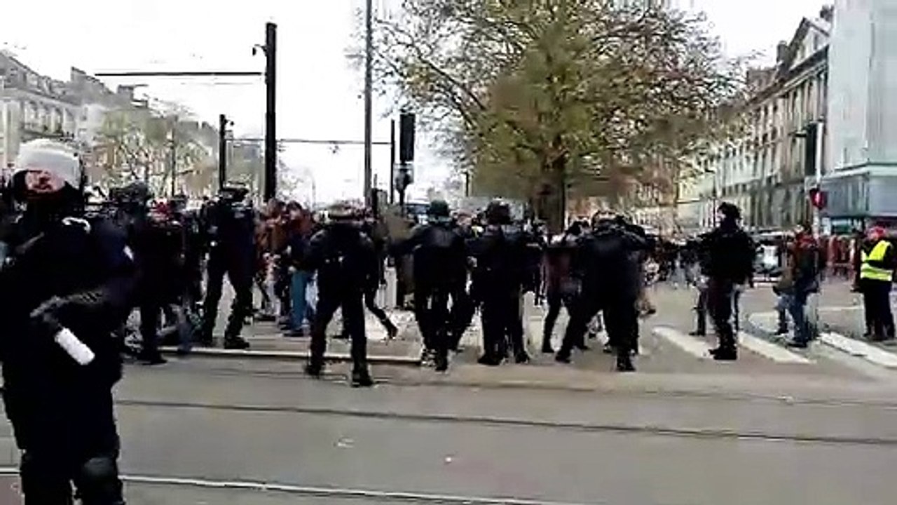 Policeman throws woman to the ground as protests against retirement reform paralyse France