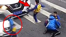 This little boy in China is his mummy's hero - he vented his anger at a car that sent his mum flying