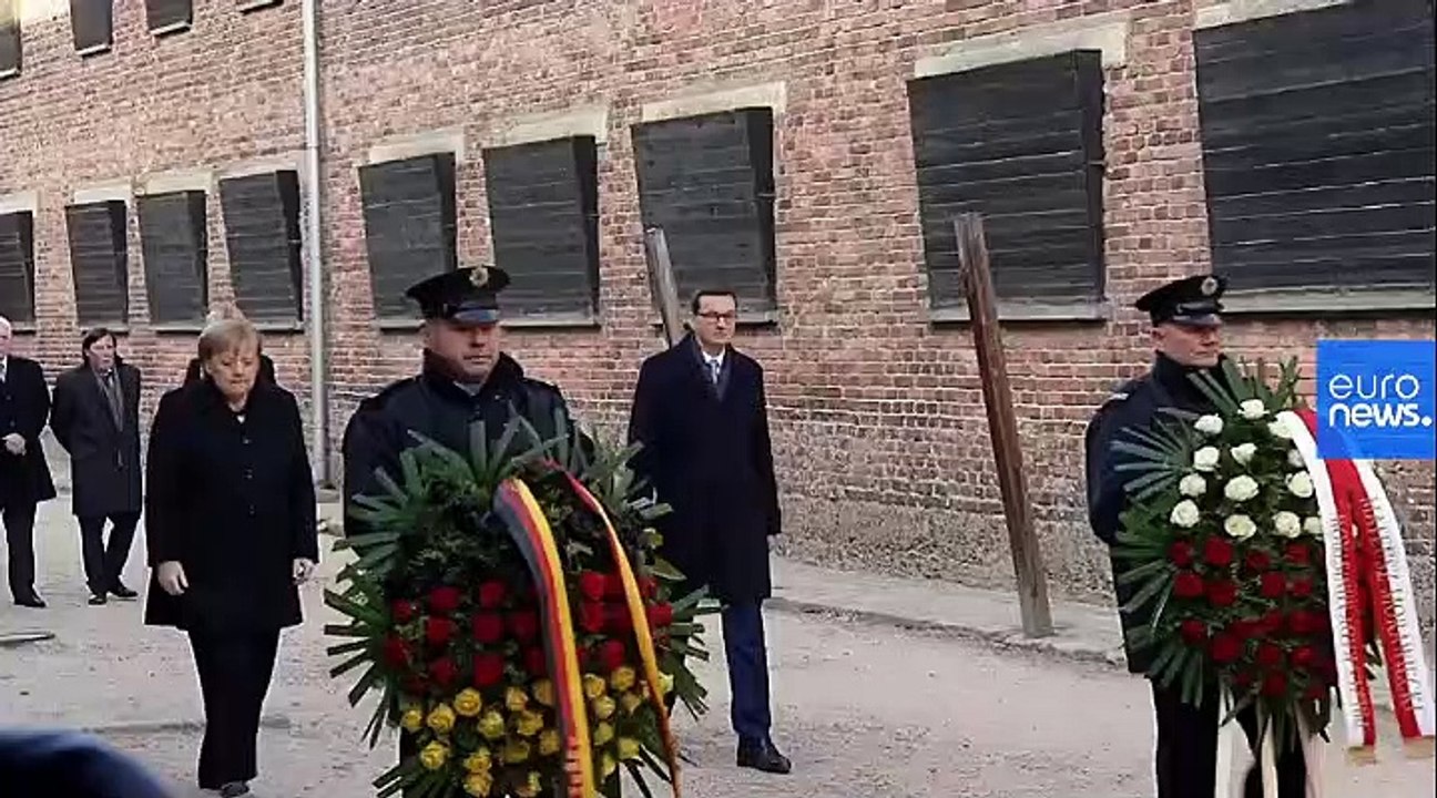 Merkel visits Auschwitz memorial for the first time after 14 years as Germany's Chancellor