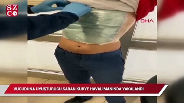 Vücuduna uyuşturucu saran kurye havalimanında yakalandı