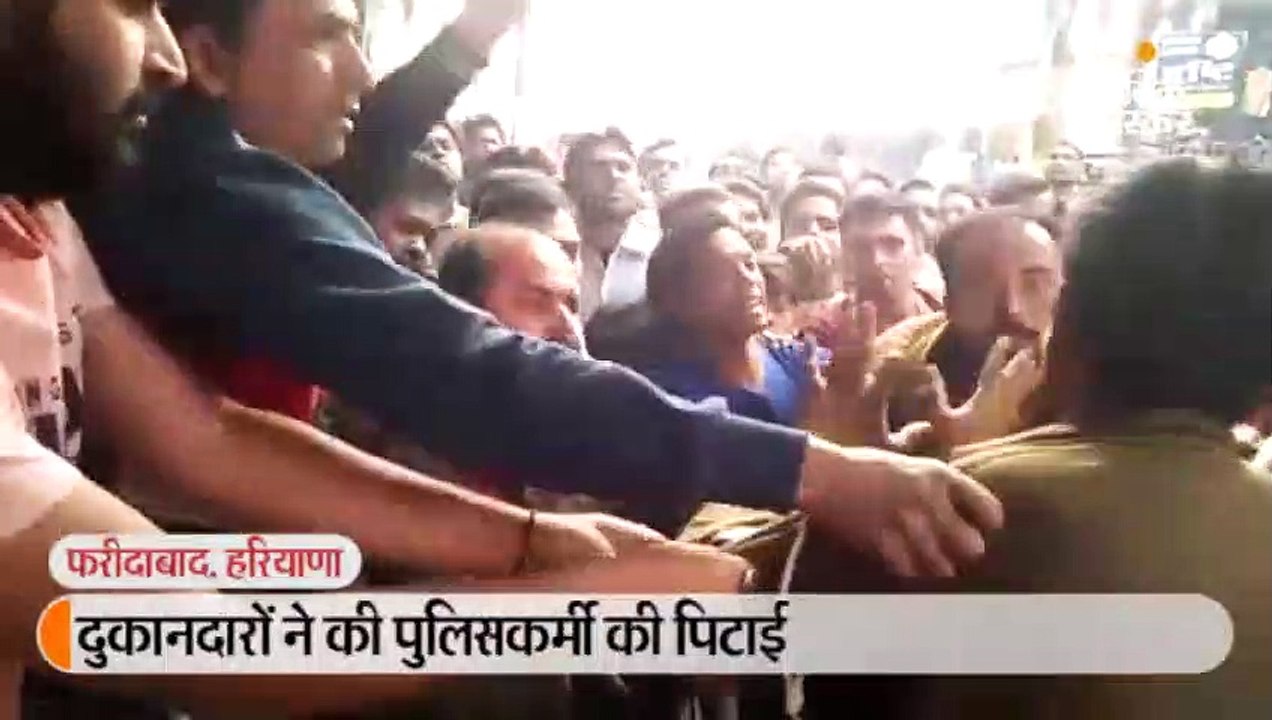 दुकानदारों ने की पुलिसकर्मी की पिटाई