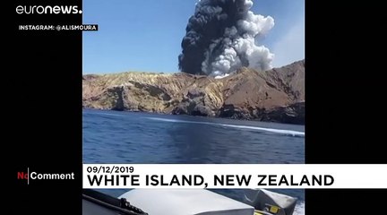 Tourists film New Zealand volcano eruption from nearby boat
