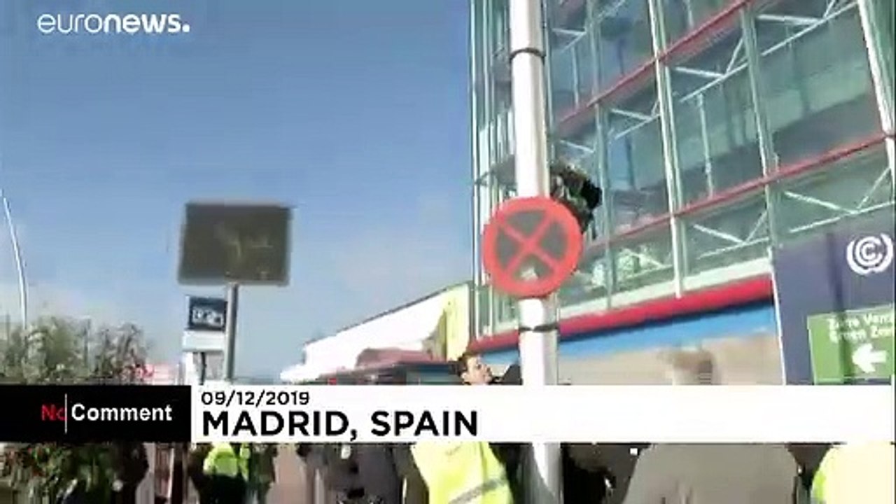 Eight-year-old scales street light to demand climate action at Madrid talks