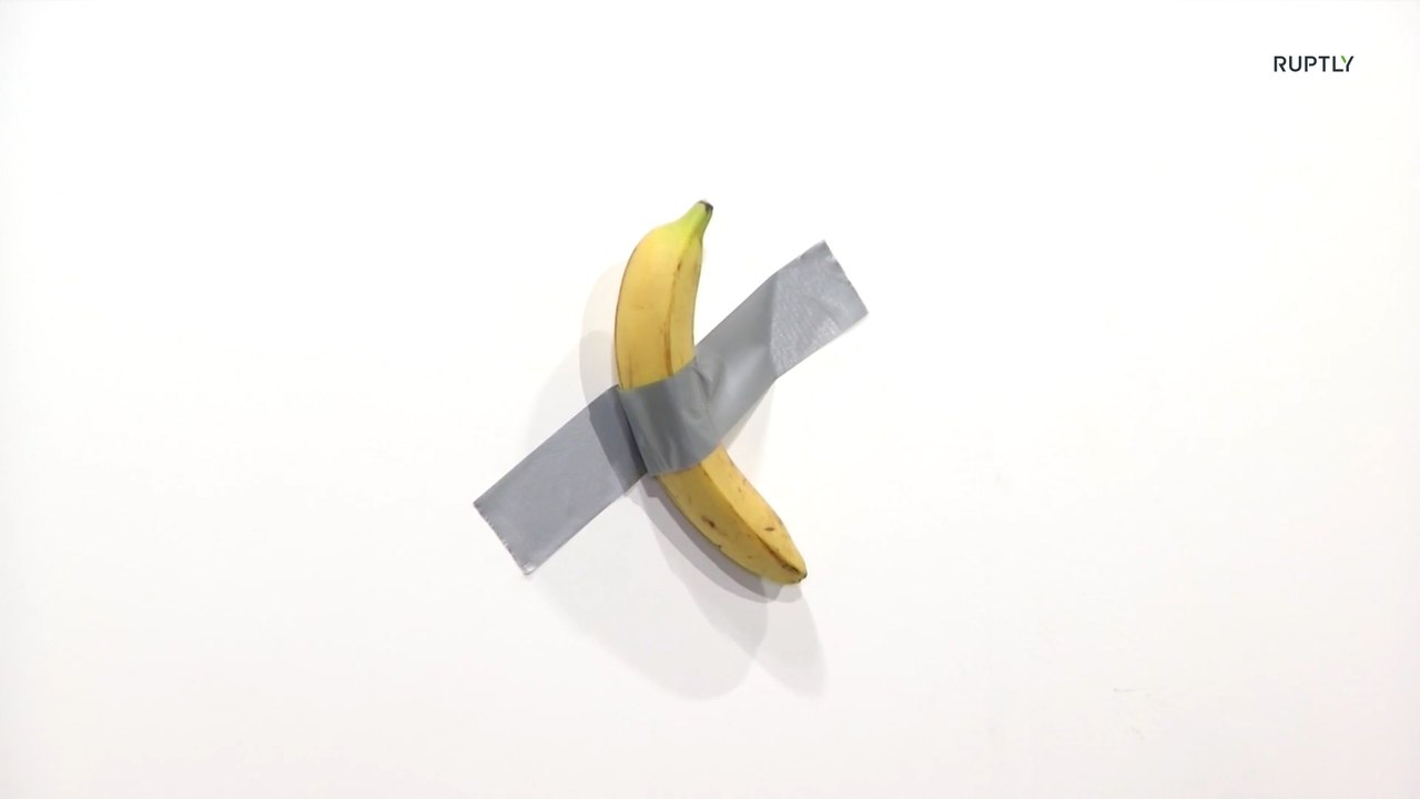 Performance artist eats banana ducttaped to wall worth 120,000
