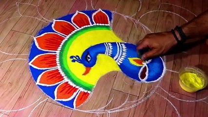 Big rangoli for Diwali. Easy, attractive and colourful peacock rangoli design