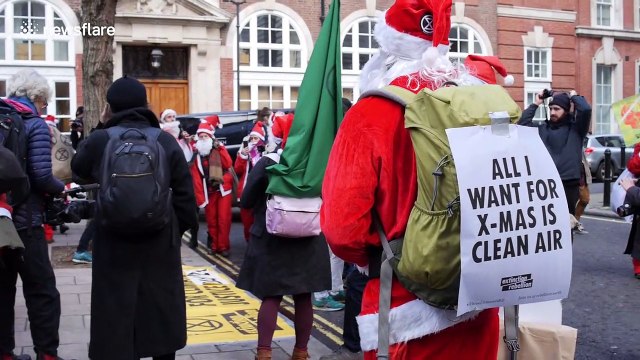 Police officer confronts Extinction Rebellion activists leaving coal outside Tory HQ in London