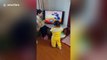 Chinese woman interacts with 'Tom and Jerry' cartoon on TV to entertain her daughter