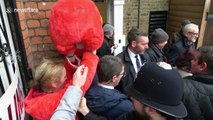 UK election: Woman in giant Elmo suit gatecrashes Jeremy Corbyn's visit to London polling station