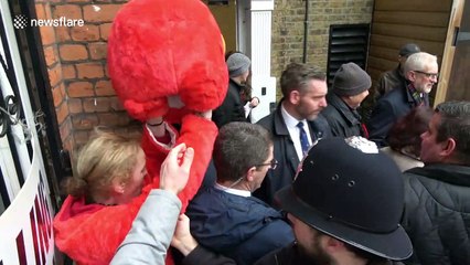 UK election: Woman in giant Elmo suit gatecrashes Jeremy Corbyn's visit to London polling station