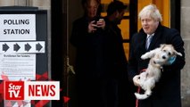 UK PM Johnson brings four-legged friend to cast vote