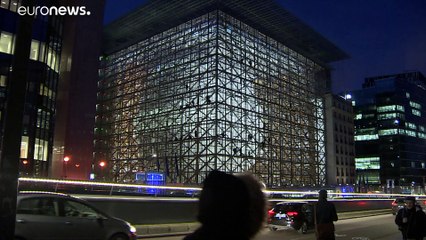 Greenpeace hang Climate Emergency banner at new EU headquarters