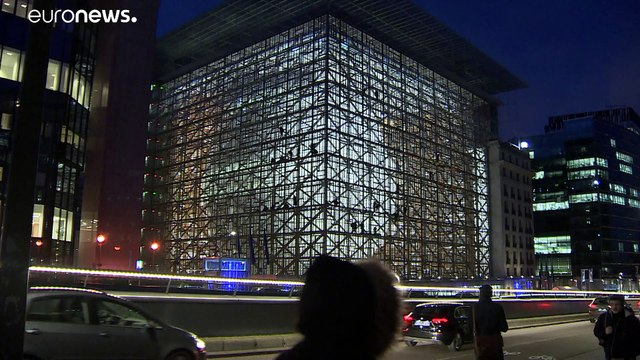 Greenpeace hang Climate Emergency banner at new EU headquarters