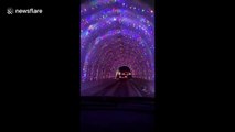 US tunnel decorated with lights is a festive treat for motorists