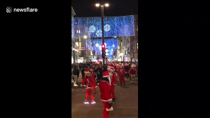 Roads in central London shut down by skating Santas