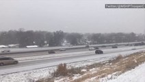 Snow begins to cover up roadways