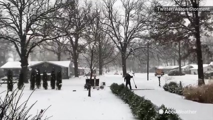 Snowflakes fall in huge clumps in this neighborhood